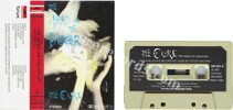 The head on the door (issued 1985). Found in either clear tape or PolyGram beige plastic tape, both with black label. - Thanks to delma.