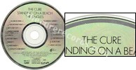 Standing on a beach � The singles (issued 1992). Title is "Standing..." instead of "Staring...". Data logo on disc. There is text around half of the outer circle. - Thanks to rafacure.