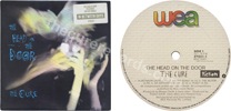 The head on the door (issued 1985). White/beige sticker reads "The new album features the new single In-between days" and "272311". - Thanks to redhill.